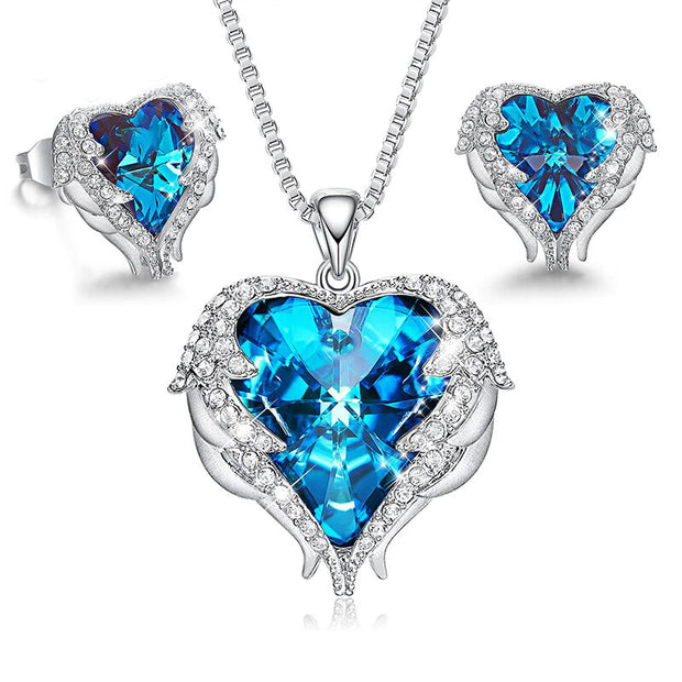 Wings of an Angel Heart Blue Topaz Necklace and Earring Set In 18K White Gold Filled